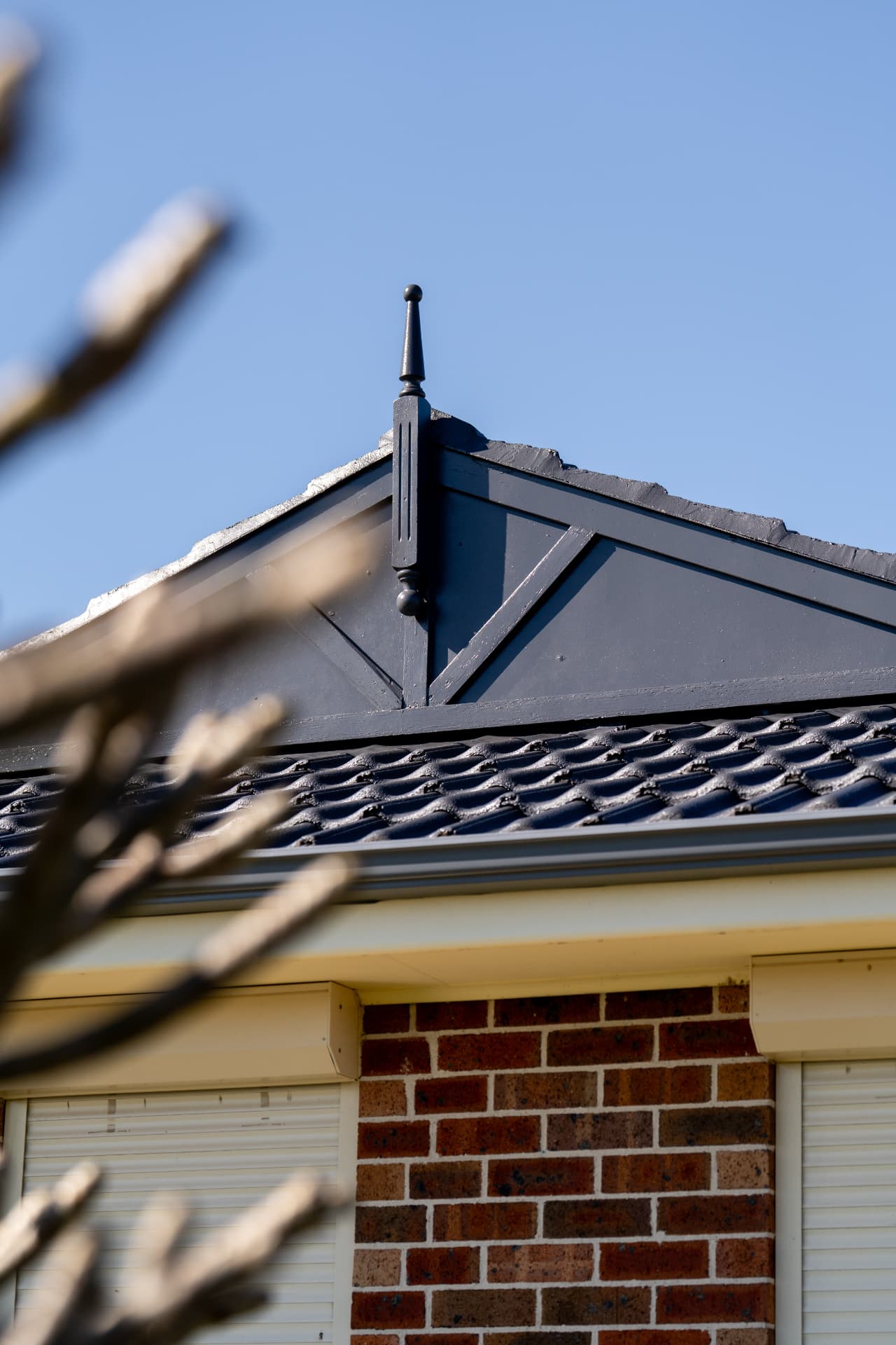 Close-up of freshly coated ridge capping and gable detail